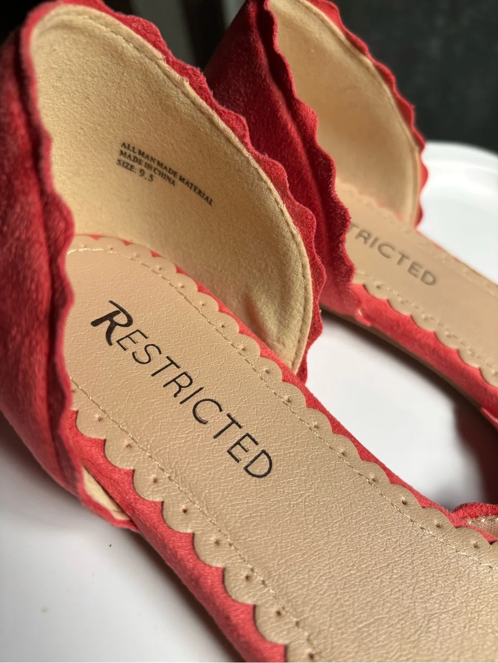 Restricted Coral Suede Flats